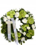 Greenish-white funeral wreath for delivery